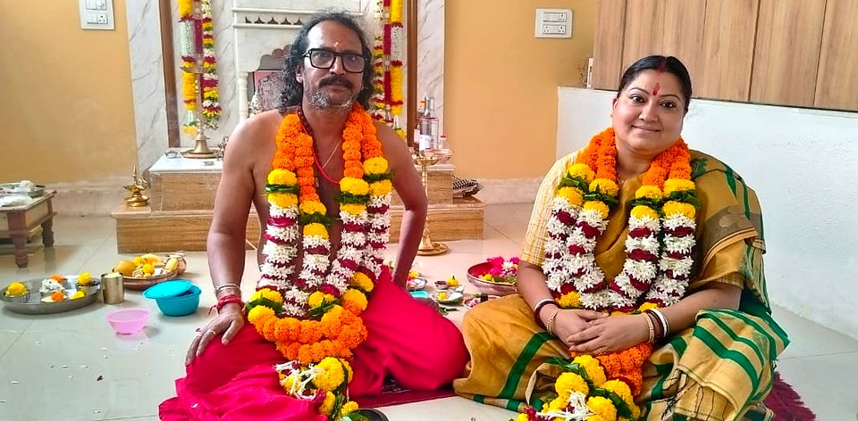 Sri Meenananda Tirthanath and Guruma Minakshi Devyomba seated together after puja.
