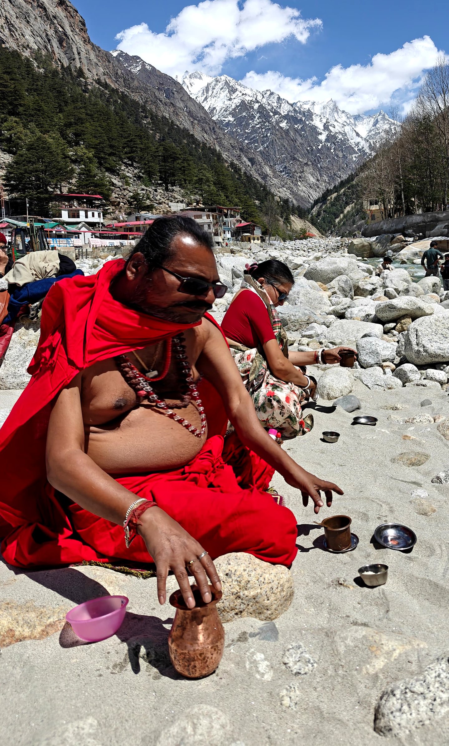 Sri Meenananda Tirthanath offering at a Himalayan riverbank.