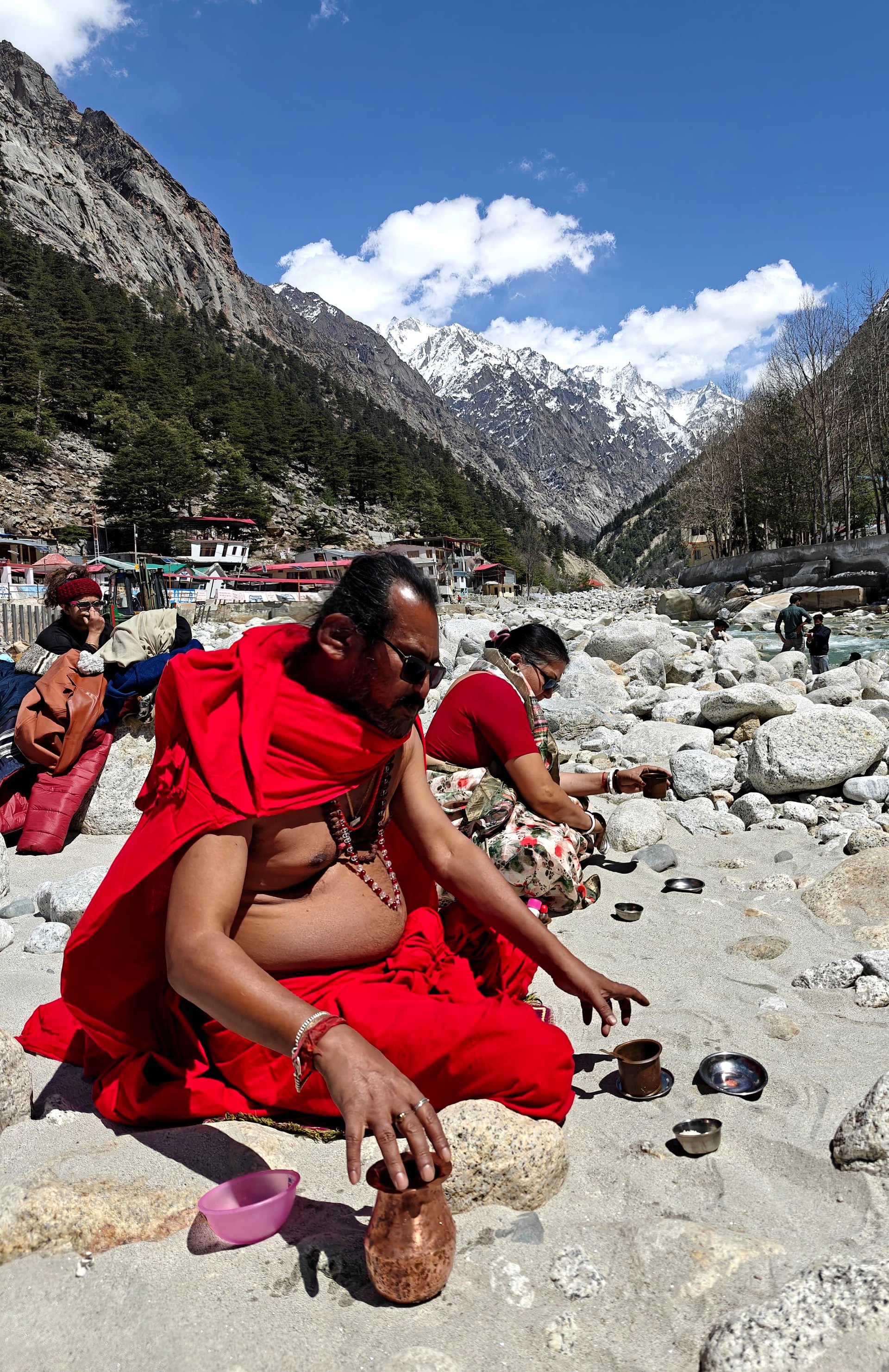 Sri Meenananda Tirthanath offering at a Himalayan riverbank.