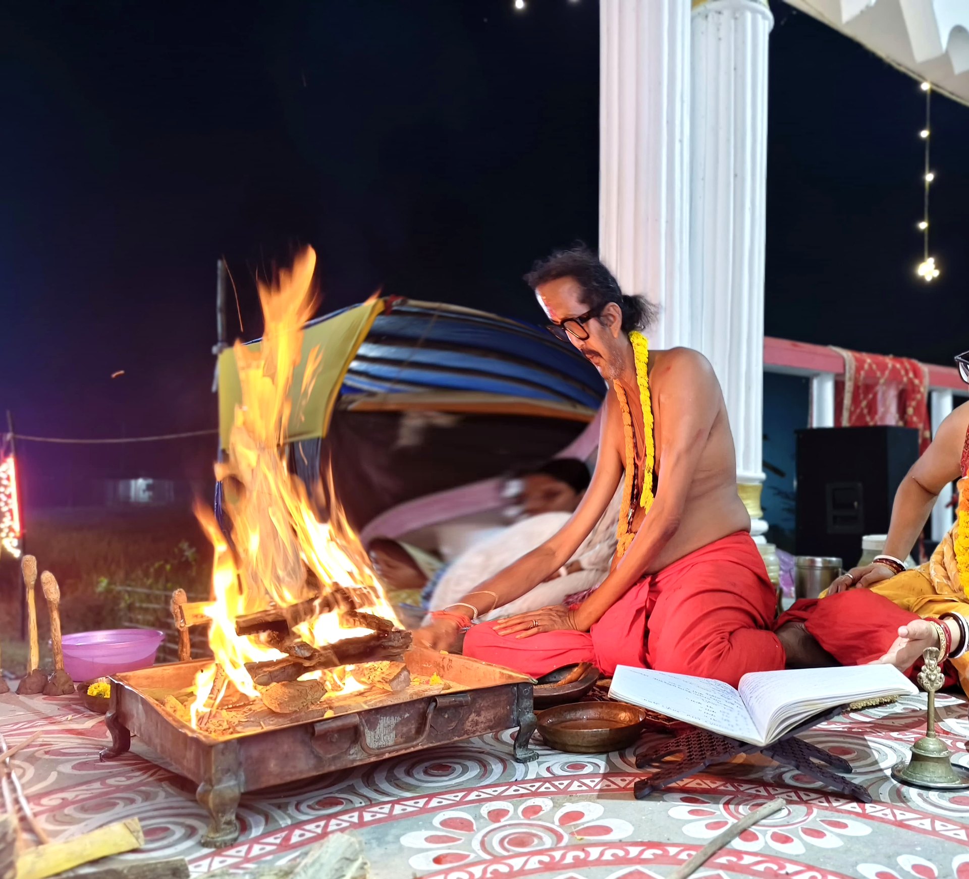 Night homa on the Ashram veranda, with the fire in the foreground.
