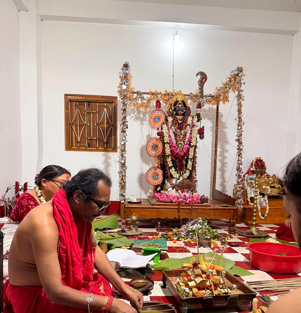 Sri Meenananda Tirthanath preparing offerings before Maa Kali and the homa.